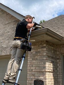 A person installing bat exclusion in Central Missouri