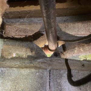 A foundation damaged by a rodent to open a hole